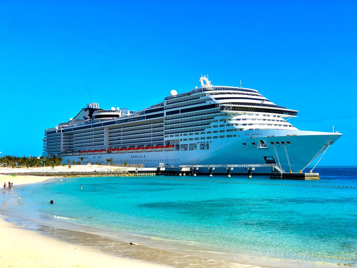 Large cruise ship docked in a tropical port