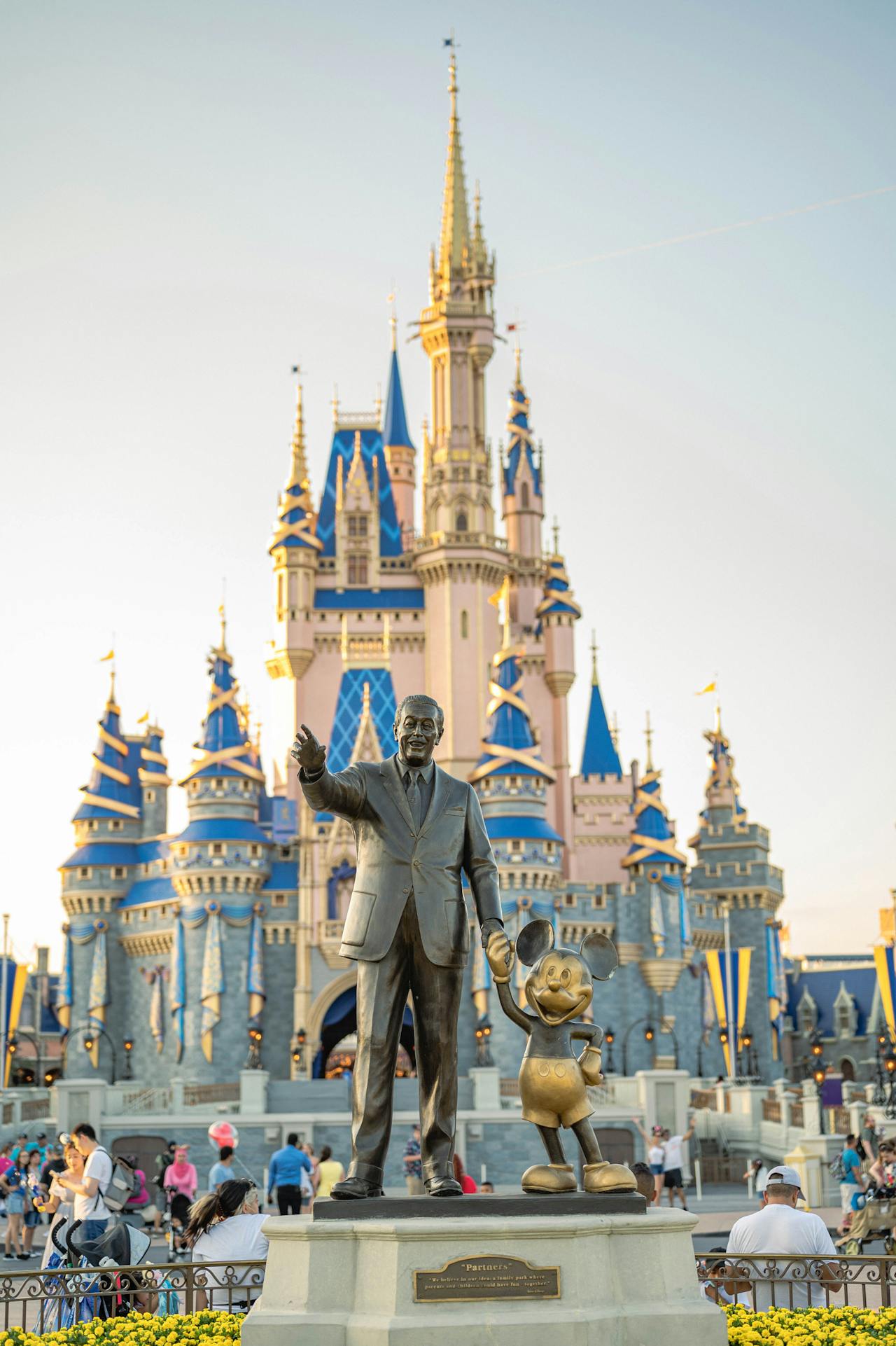 Partners statue of Walt Disney and Mickey Mouse in front of Cinderella Castle
